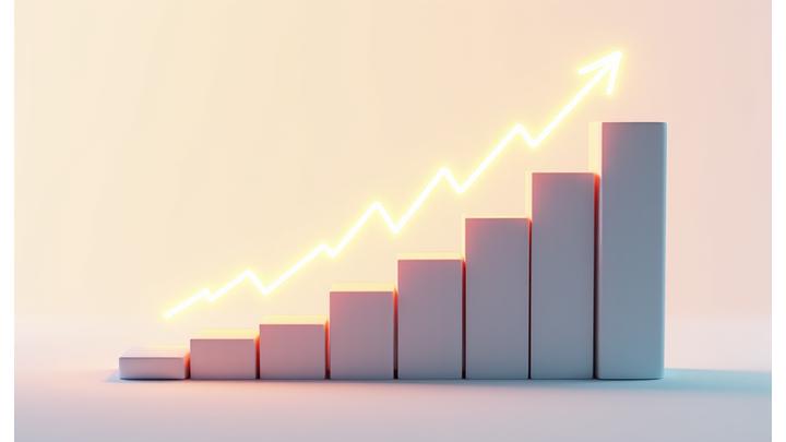 Escalera de cubos ascendente, con un gráfico de crecimiento superpuesto, simbolizando el escalamiento de un negocio.